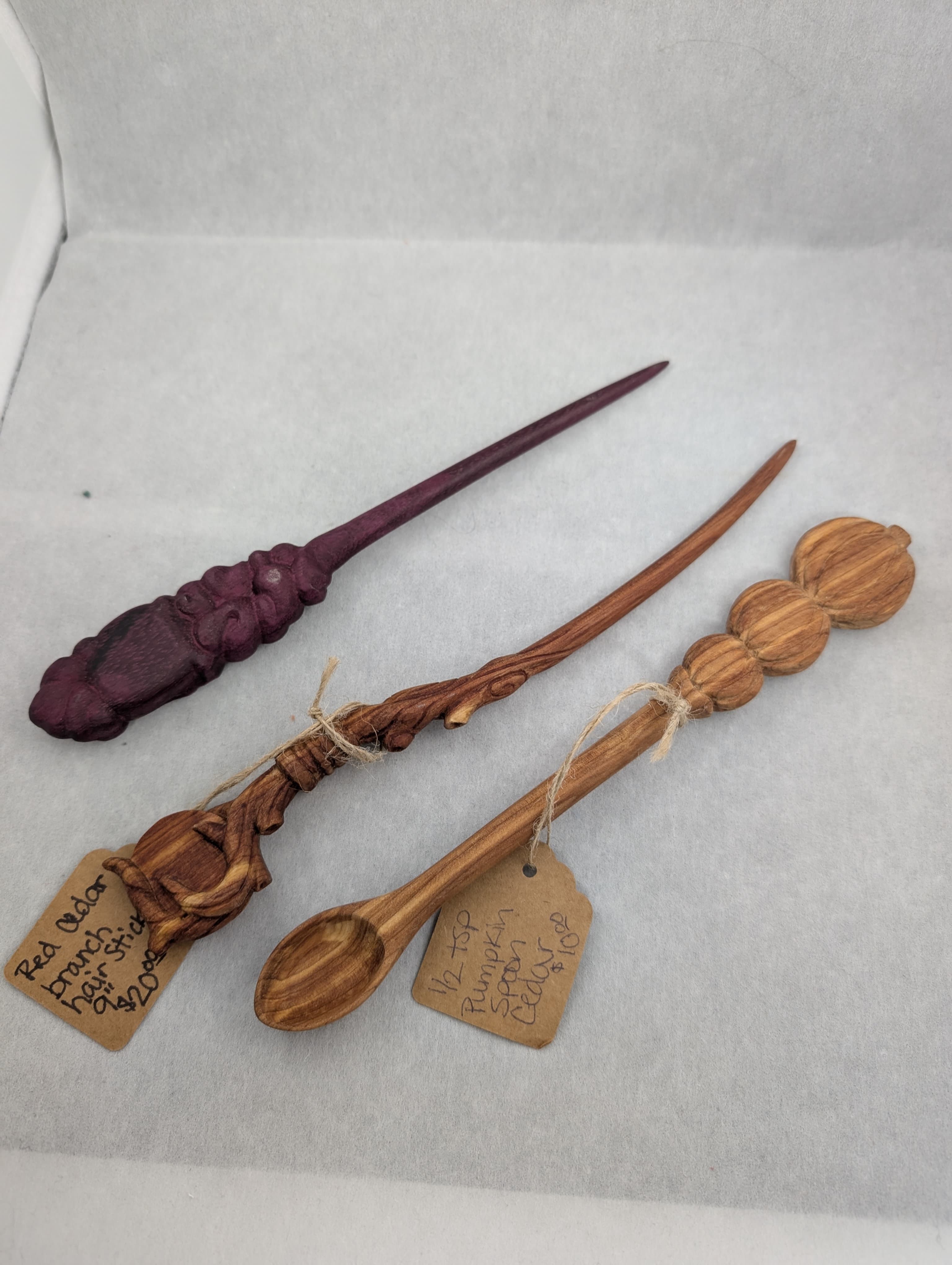 Carved hair stick and teaspoon